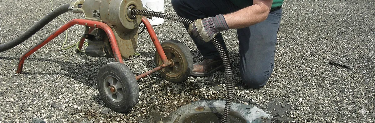 sewer rodding technician actively removing blockages from a sewer line in Los Angeles, CA